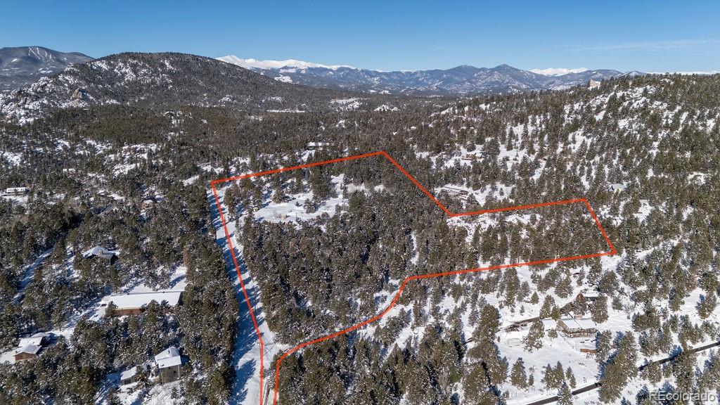 8939 South Hillview Road Morrison, CO 80465 - Photo 3 of 17 a view of city and mountain