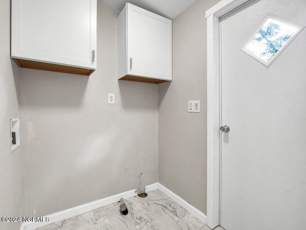718 Shell Street Hampstead, NC 28443 - Photo 8 of 26 Laundry room and back door