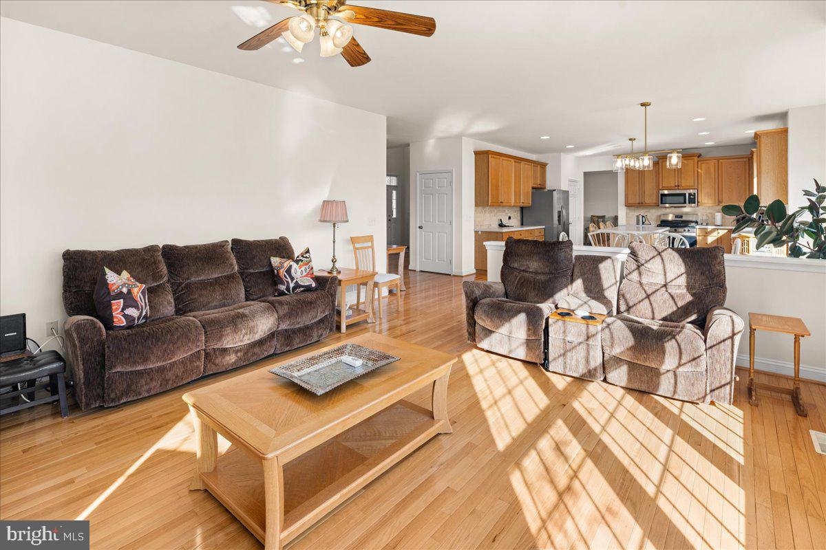 1 Gardengate Court Columbus, NJ 08022 - Photo 18 of 41 a living room with furniture and a chandelier