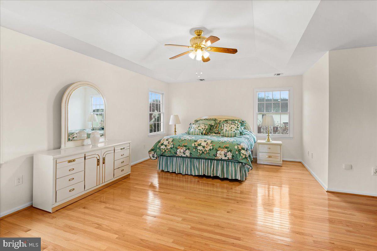 1 Gardengate Court Columbus, NJ 08022 - Photo 20 of 41 a bedroom with a bed and a chandelier