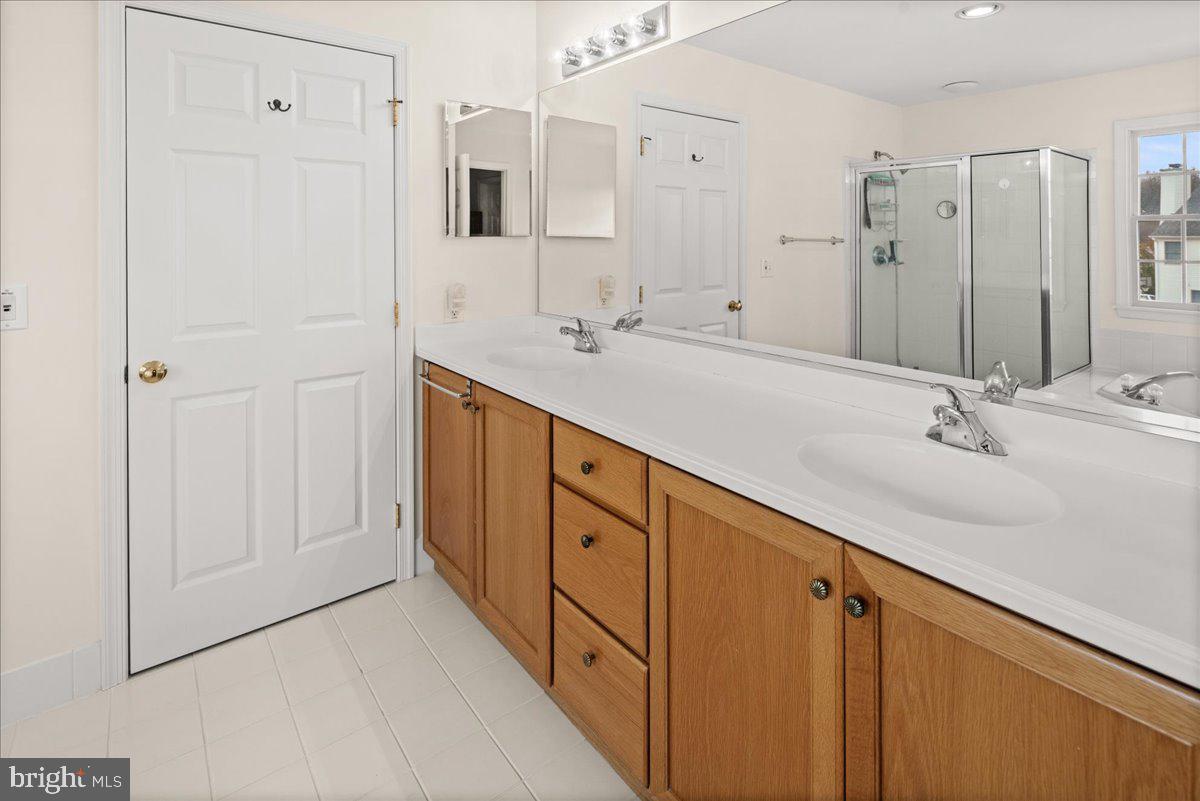 1 Gardengate Court Columbus, NJ 08022 - Photo 25 of 41 a spacious bathroom with a double vanity sink a large mirror and shower