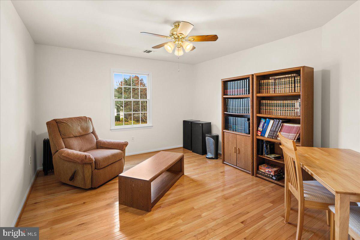 1 Gardengate Court Columbus, NJ 08022 - Photo 28 of 41 a living room with furniture and a book shelf