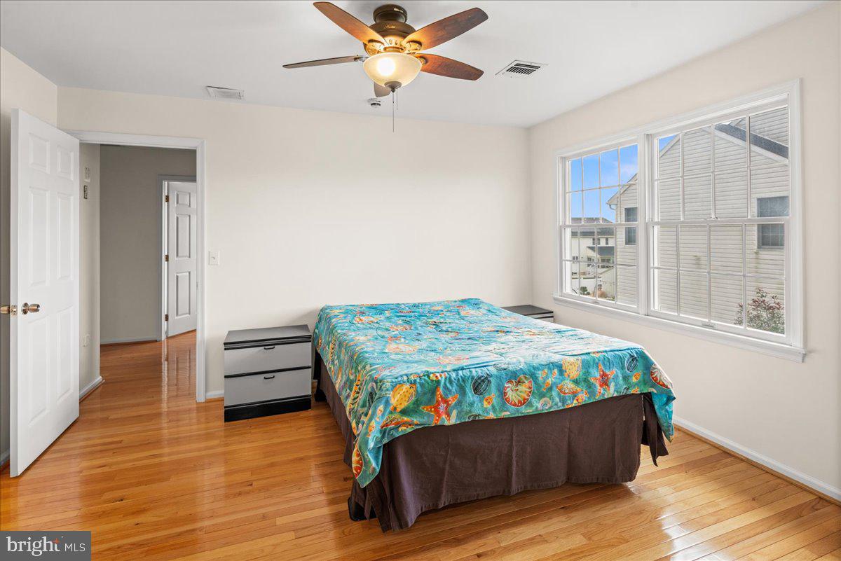 1 Gardengate Court Columbus, NJ 08022 - Photo 30 of 41 a bedroom with a bed and wooden floor