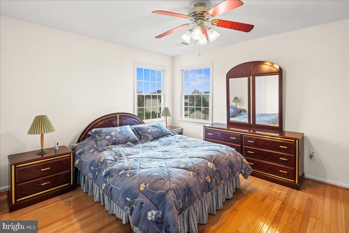 1 Gardengate Court Columbus, NJ 08022 - Photo 33 of 41 a bedroom with a bed and a chandelier