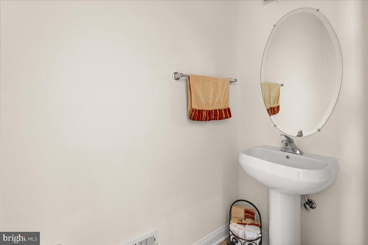 1 Gardengate Court Columbus, NJ 08022 - Photo 37 of 41 a bathroom with a sink and a mirror