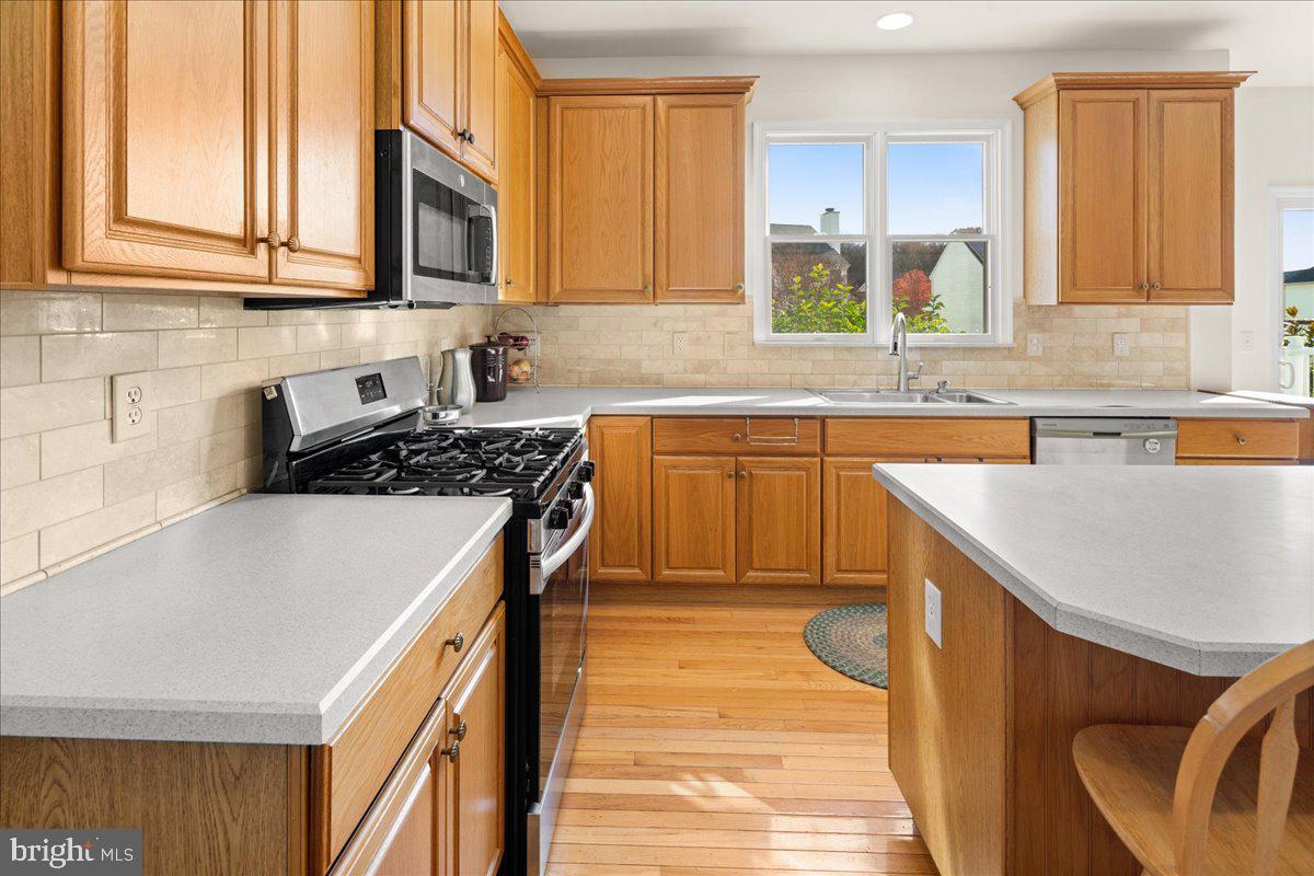 1 Gardengate Court Columbus, NJ 08022 - Photo 9 of 41 a kitchen with stainless steel appliances granite countertop a sink stove and cabinets