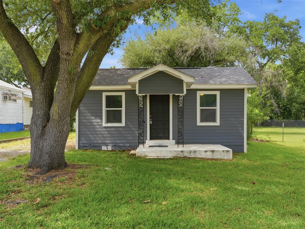 519 East Gandy Street Denison, TX 75021 - Photo 1 of 1 a front view of house with a garden