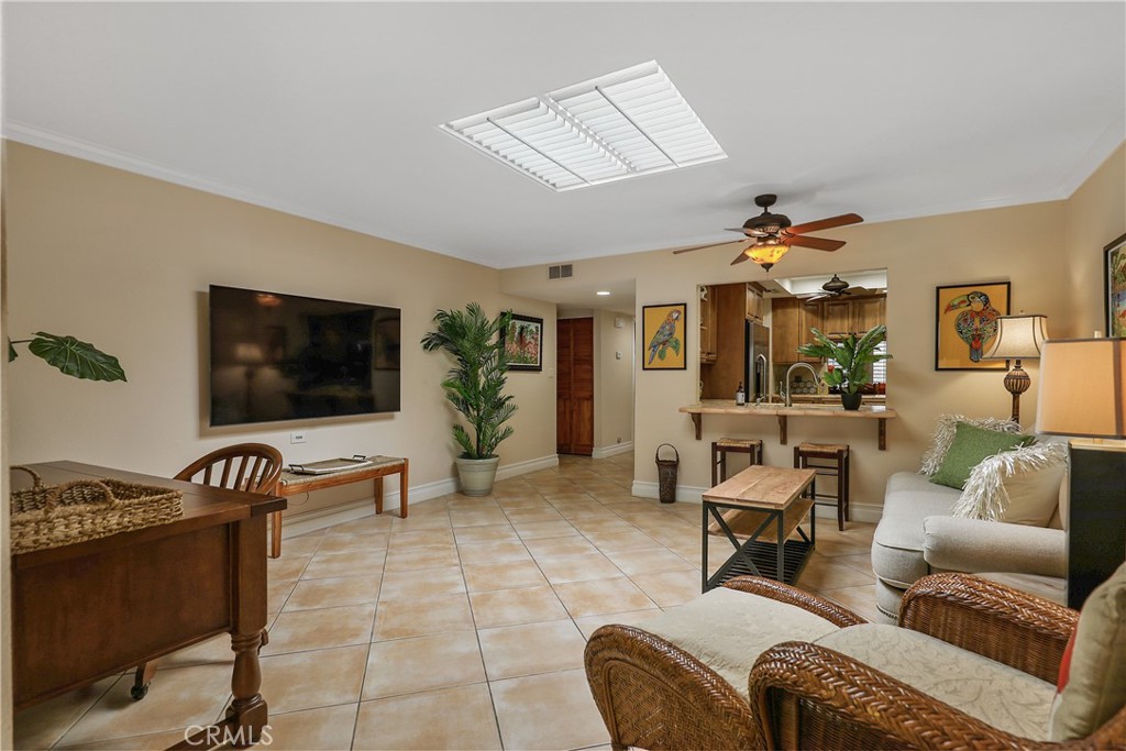 6 Tortosa Drive Rancho Mirage, CA 92270 - Photo 11 of 24 a living room with furniture and a flat screen tv