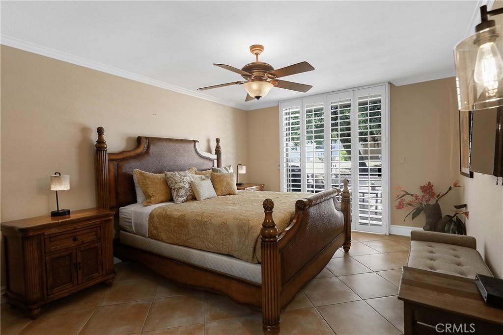 6 Tortosa Drive Rancho Mirage, CA 92270 - Photo 13 of 24 a bed room with a bed and a window