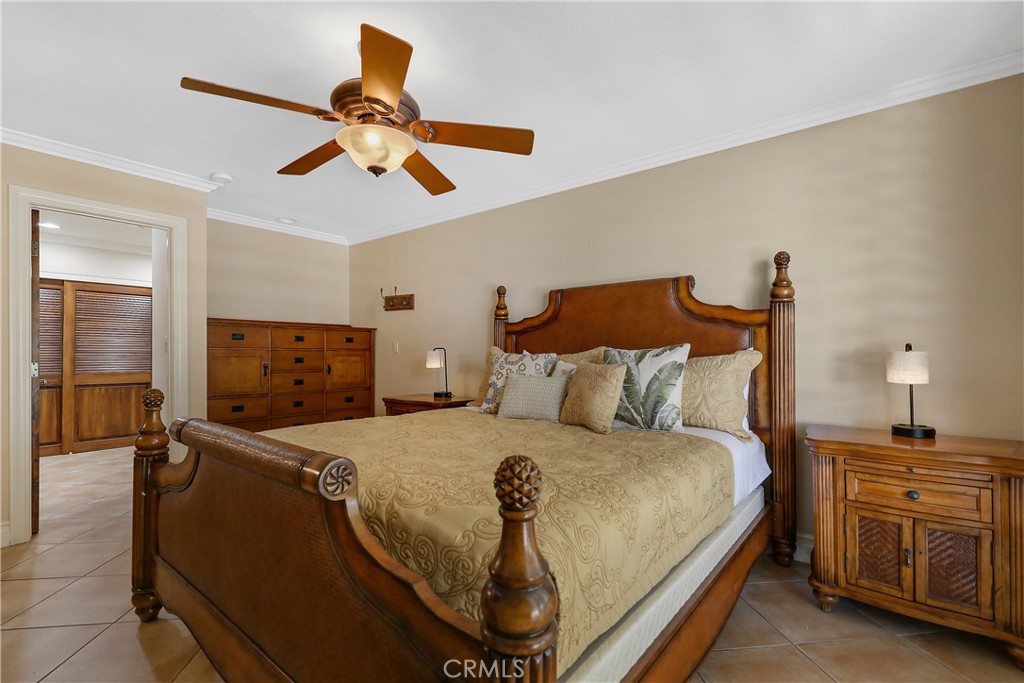 6 Tortosa Drive Rancho Mirage, CA 92270 - Photo 14 of 24 a bedroom with a bed and dresser