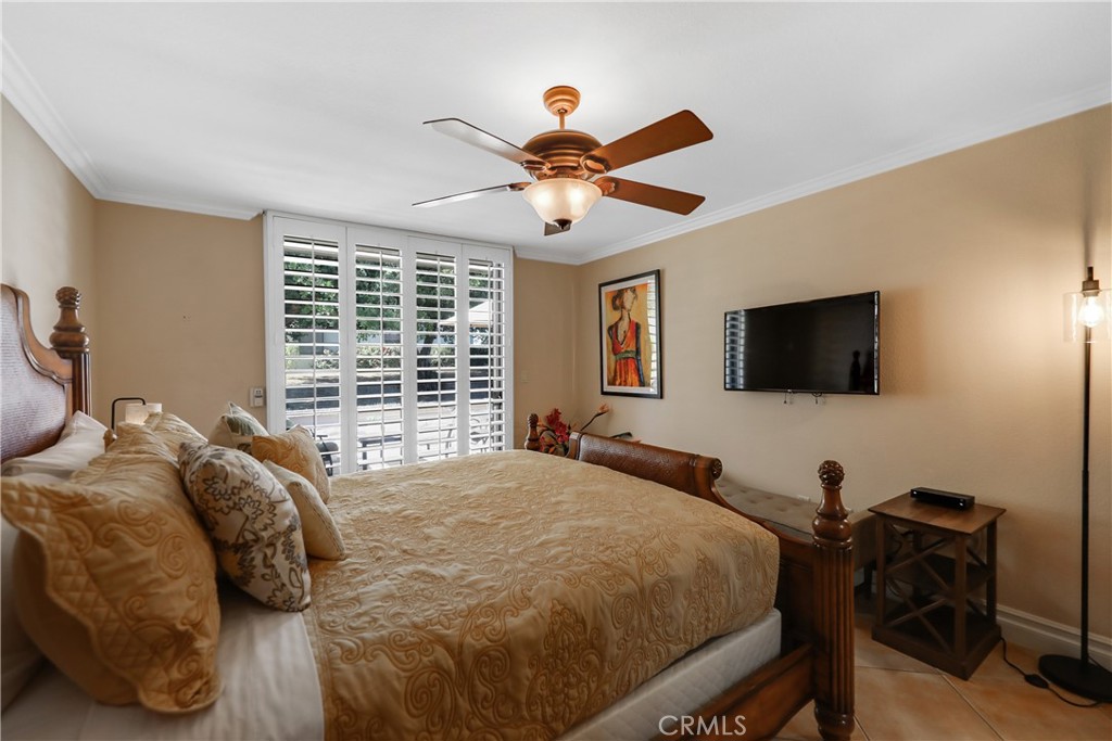 6 Tortosa Drive Rancho Mirage, CA 92270 - Photo 15 of 24 a bedroom with a bed and a flat screen tv