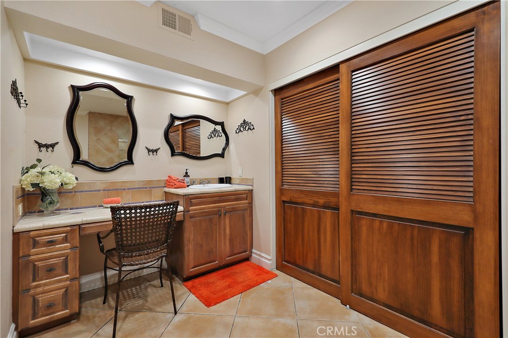 6 Tortosa Drive Rancho Mirage, CA 92270 - Photo 16 of 24 a bathroom with a sink a mirror and a shower