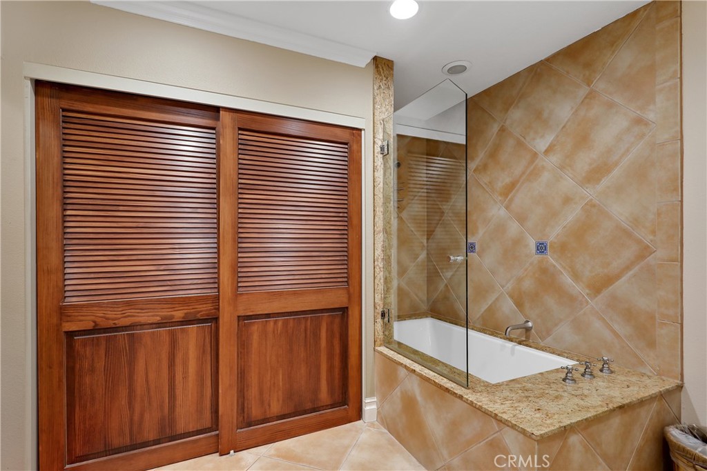 6 Tortosa Drive Rancho Mirage, CA 92270 - Photo 17 of 24 a bathroom with a sink and shower