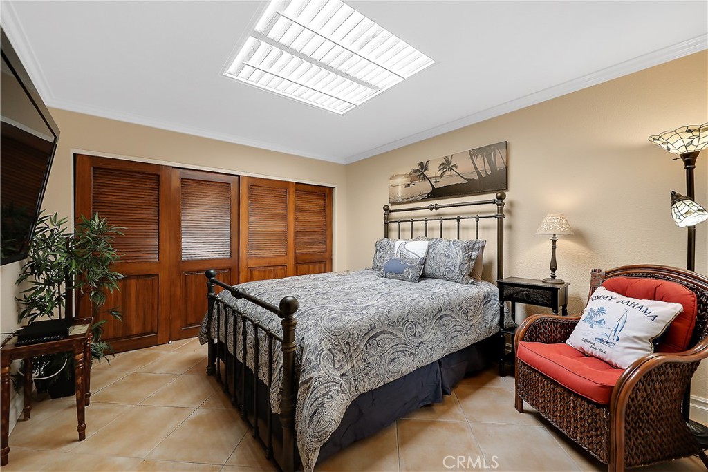6 Tortosa Drive Rancho Mirage, CA 92270 - Photo 18 of 24 a bedroom with bed and window