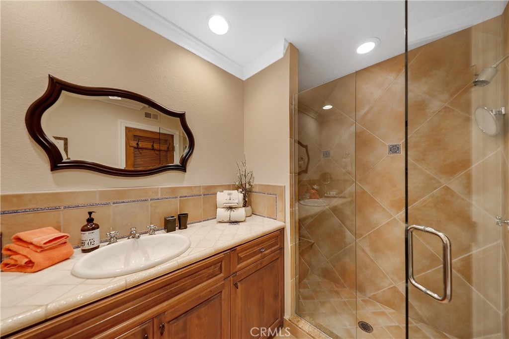 6 Tortosa Drive Rancho Mirage, CA 92270 - Photo 19 of 24 a bathroom with a sink and a mirror