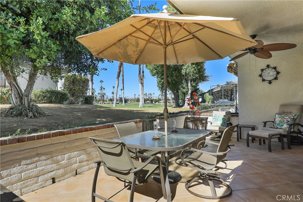 6 Tortosa Drive Rancho Mirage, CA 92270 - Photo 22 of 24 a patio with a patio table and chairs