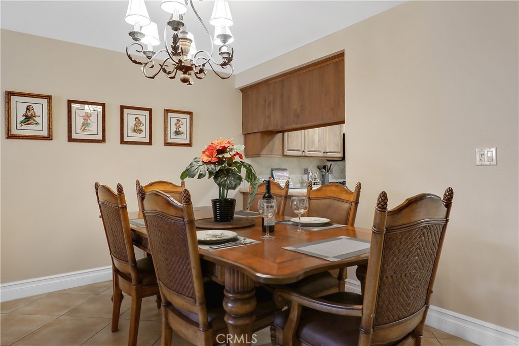 6 Tortosa Drive Rancho Mirage, CA 92270 - Photo 5 of 24 a view of a dining room with furniture and chandelier