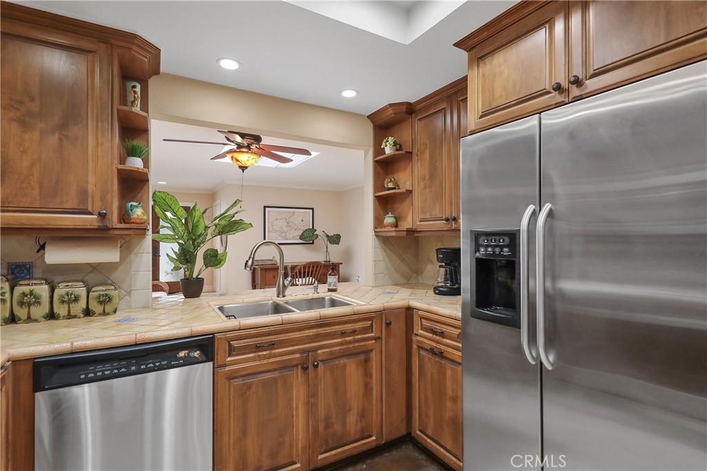 6 Tortosa Drive Rancho Mirage, CA 92270 - Photo 7 of 24 a kitchen with a sink and refrigerator