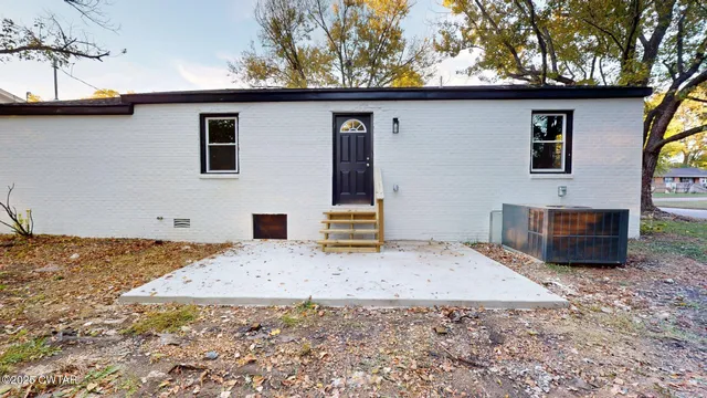a view of a house with a snow in the yard