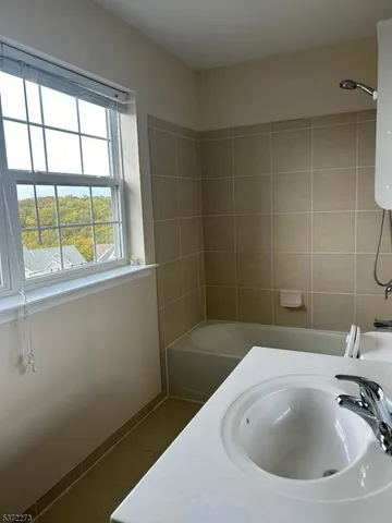 a bathroom with a sink and a bathtub
