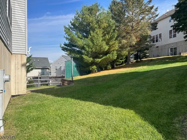 a view of a house with a big yard