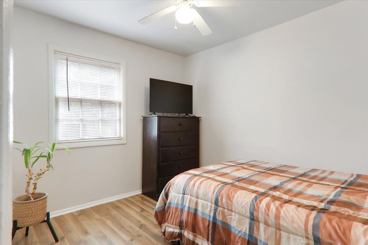 1812 Shady Crest Street Decatur, IL 62521 - Photo 13 of 16 a bedroom with a bed and a flat screen tv