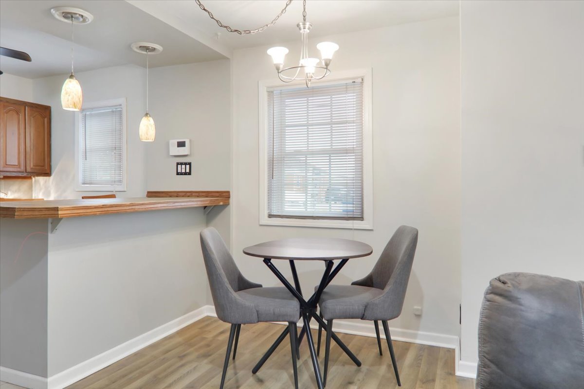 1812 Shady Crest Street Decatur, IL 62521 - Photo 5 of 16 a view of a dining room with furniture and wooden floor