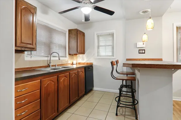 a kitchen with stainless steel appliances a sink and cabinets