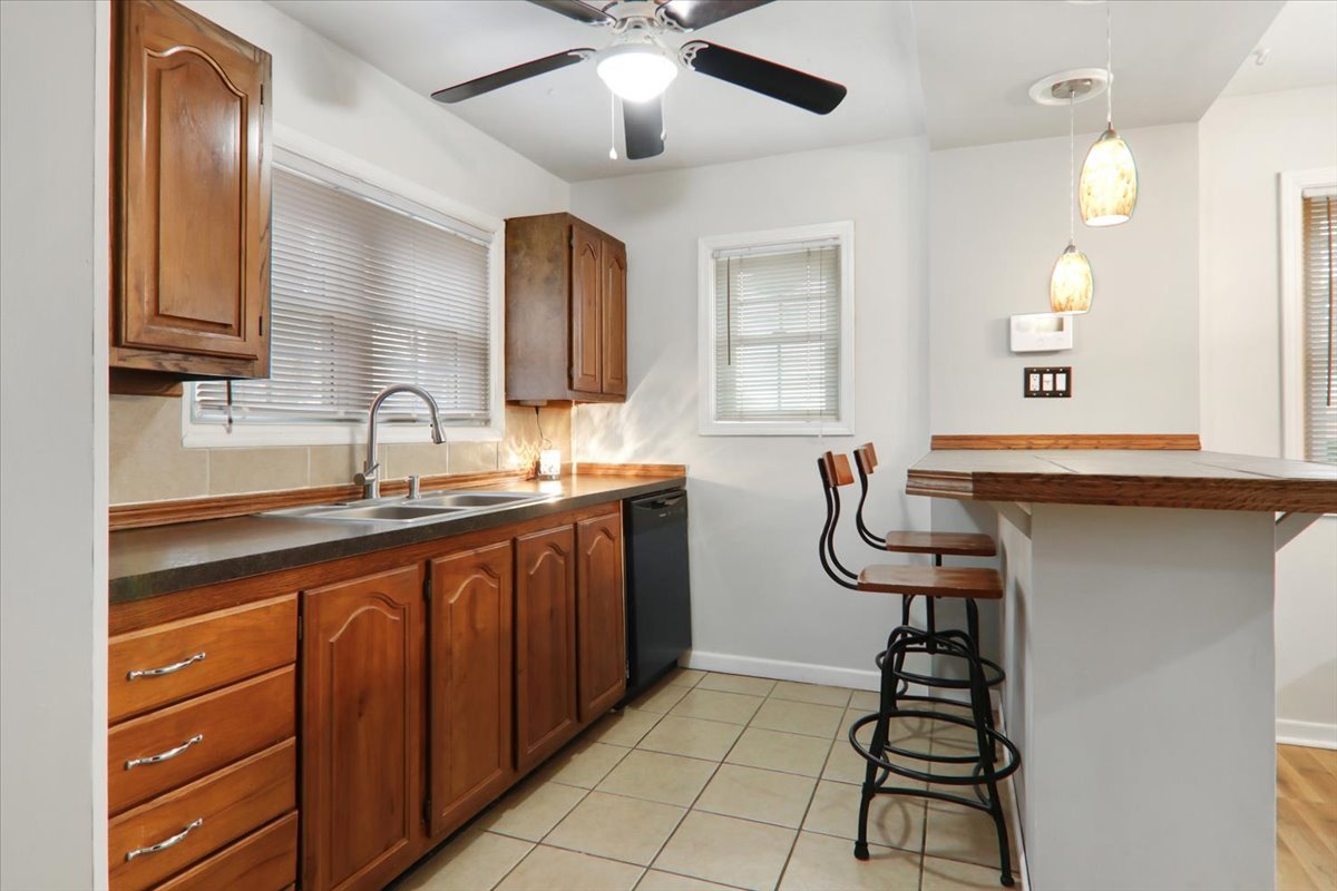 1812 Shady Crest Street Decatur, IL 62521 - Photo 7 of 16 a kitchen with stainless steel appliances a sink and cabinets