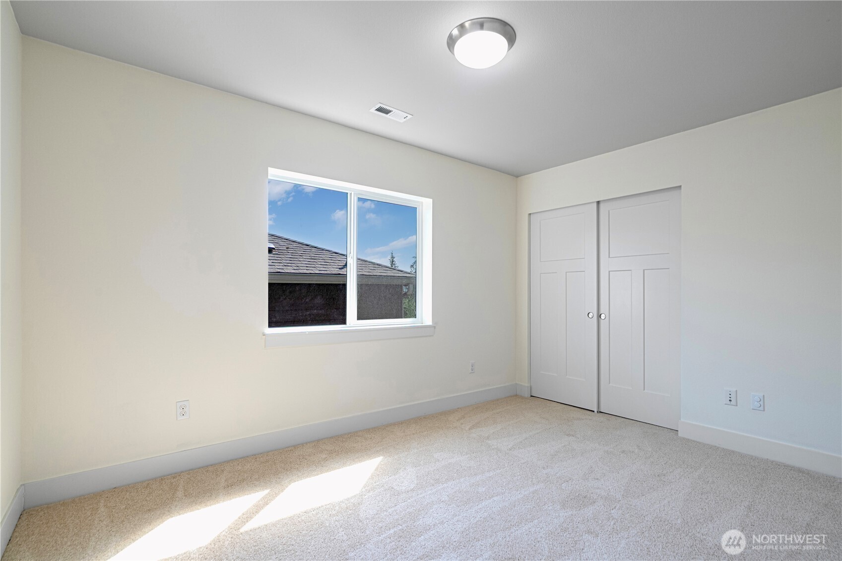 1130 199th Street Southeast Bothell, WA 98012 - Photo 19 of 33 a view of an empty room with a window