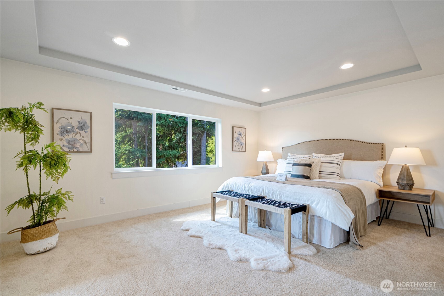 1130 199th Street Southeast Bothell, WA 98012 - Photo 21 of 33 a bedroom with a bed and a potted plant