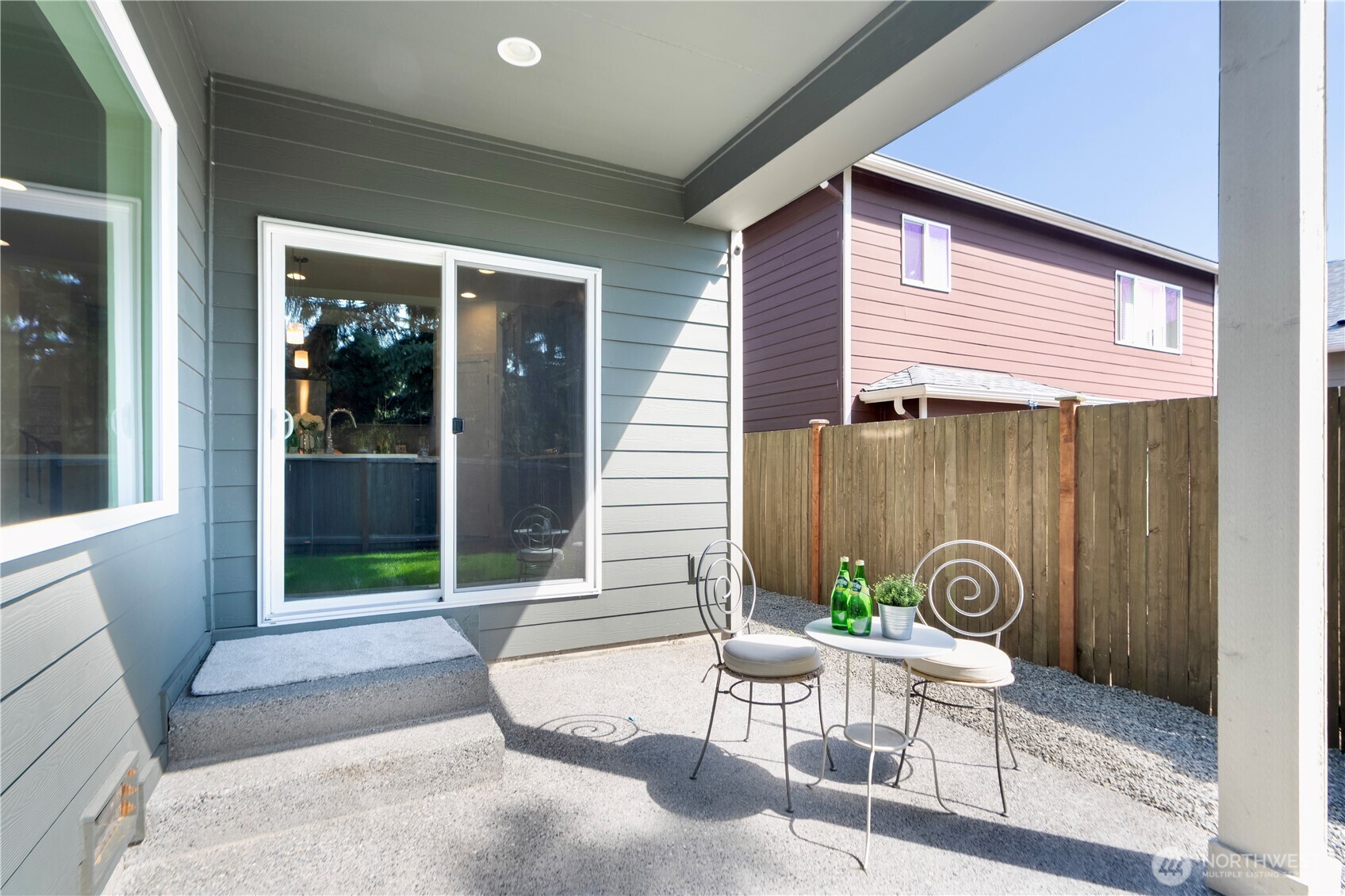 1130 199th Street Southeast Bothell, WA 98012 - Photo 29 of 33 a front view of a house with outdoor seating and a potted plant