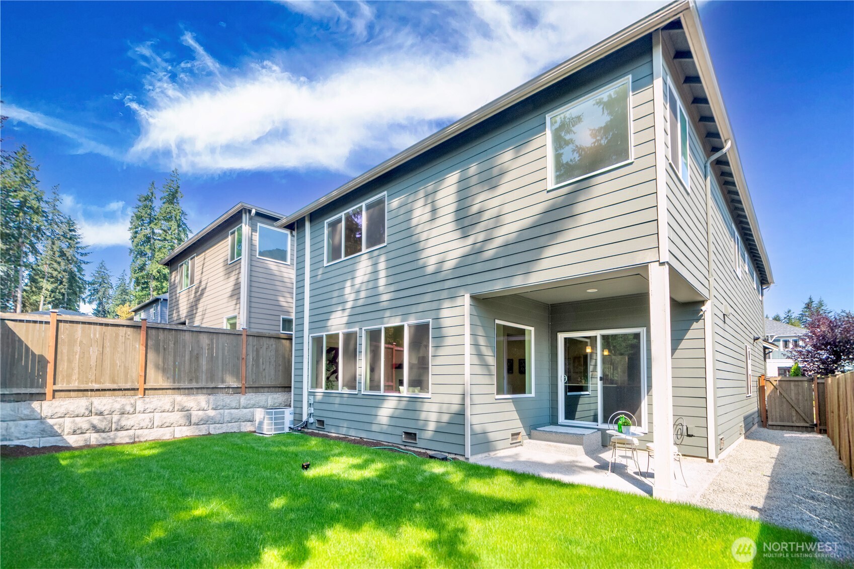 1130 199th Street Southeast Bothell, WA 98012 - Photo 30 of 33 a view of a house with a yard and sitting area