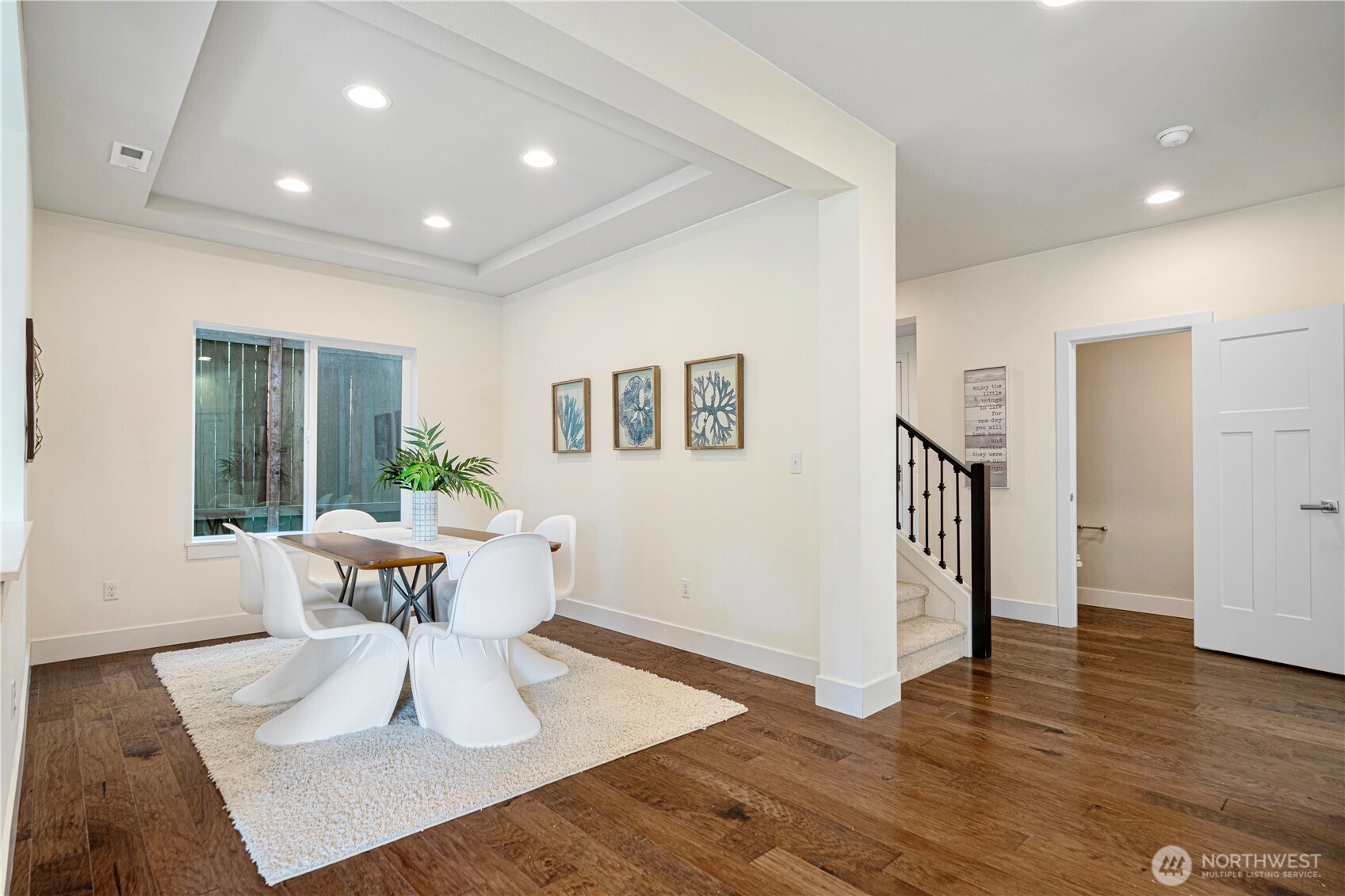 1130 199th Street Southeast Bothell, WA 98012 - Photo 8 of 33 a view of a dining room with furniture window and wooden floor