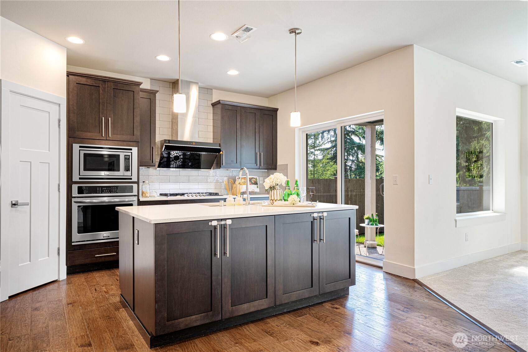 1130 199th Street Southeast Bothell, WA 98012 - Photo 9 of 33 a kitchen with a stove a refrigerator and a sink