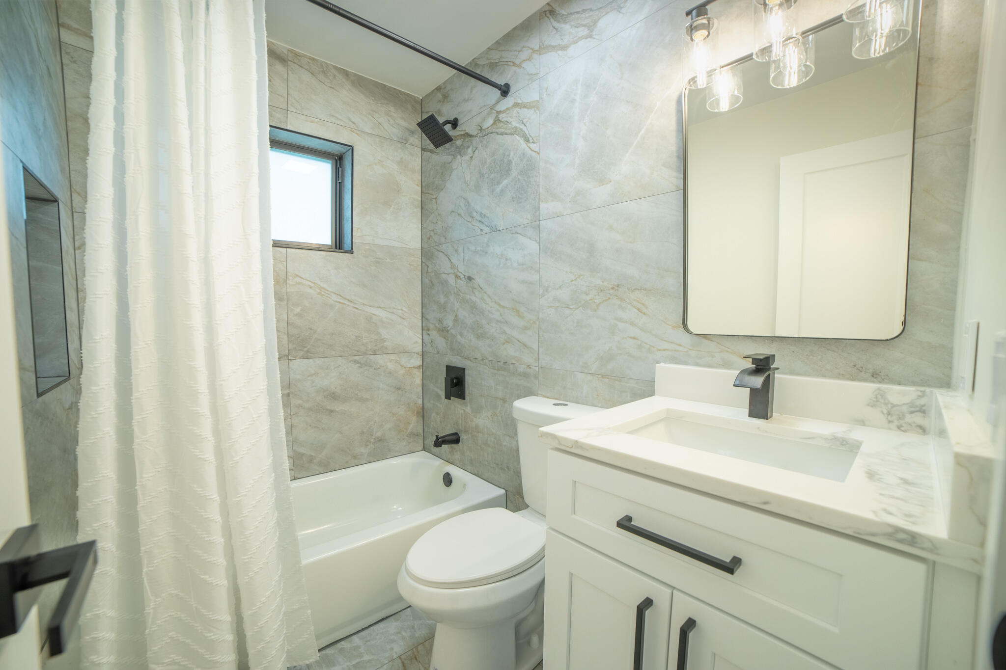 809 Southeast 12th Street Okeechobee, FL 34974 - Photo 14 of 62 a bathroom with a sink toilet vanity and shower