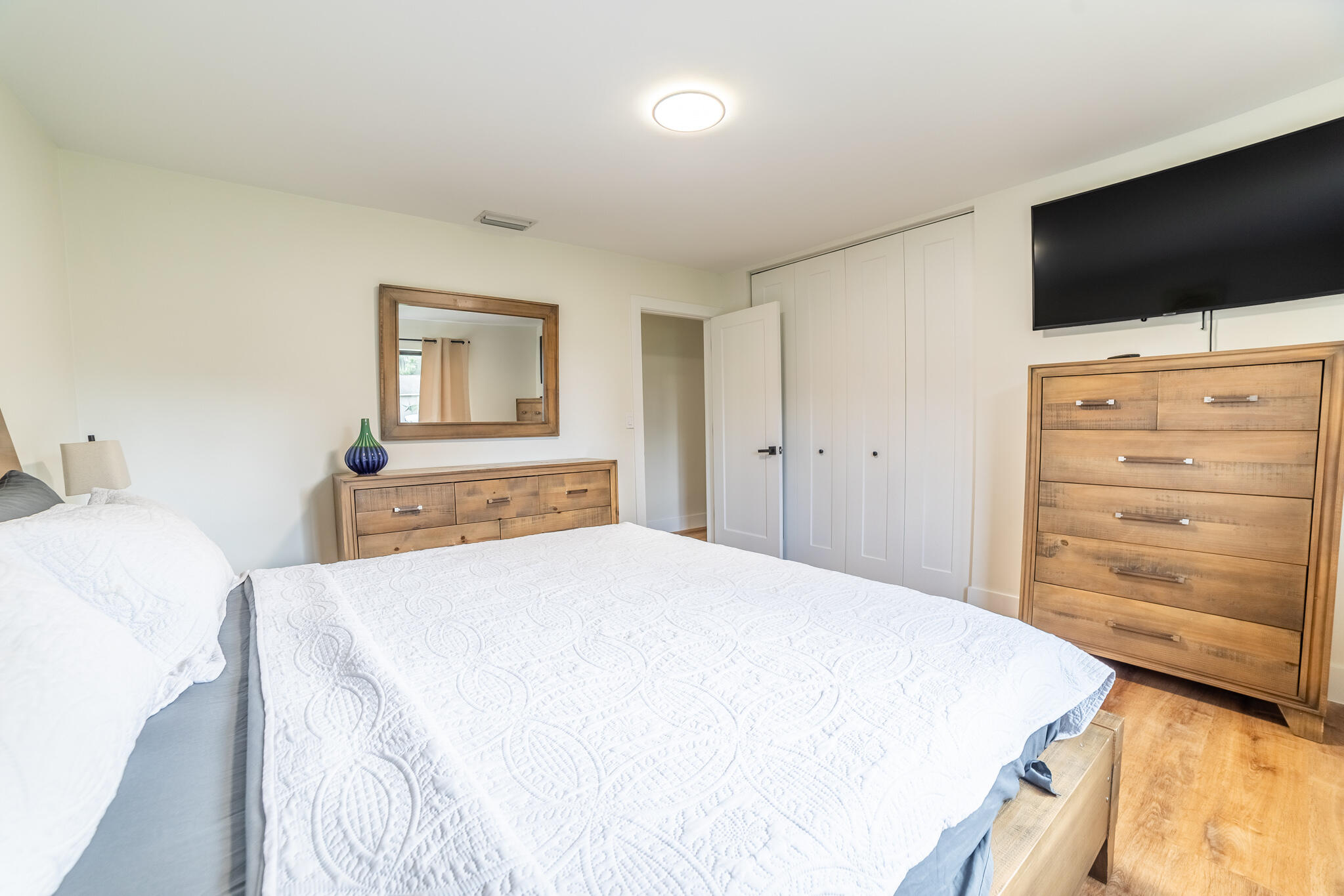 809 Southeast 12th Street Okeechobee, FL 34974 - Photo 16 of 62 a bedroom with a bed and a flat screen tv