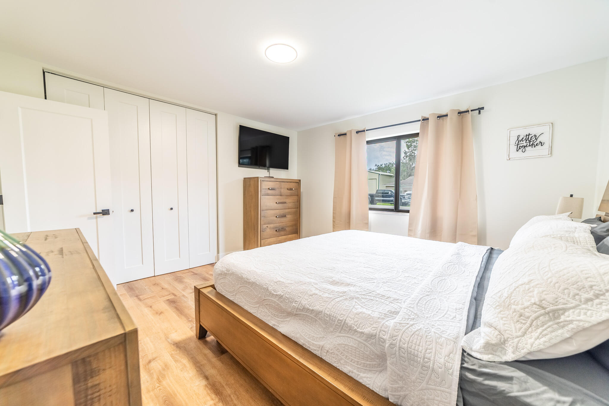 809 Southeast 12th Street Okeechobee, FL 34974 - Photo 17 of 62 a bedroom with a bed and a couch