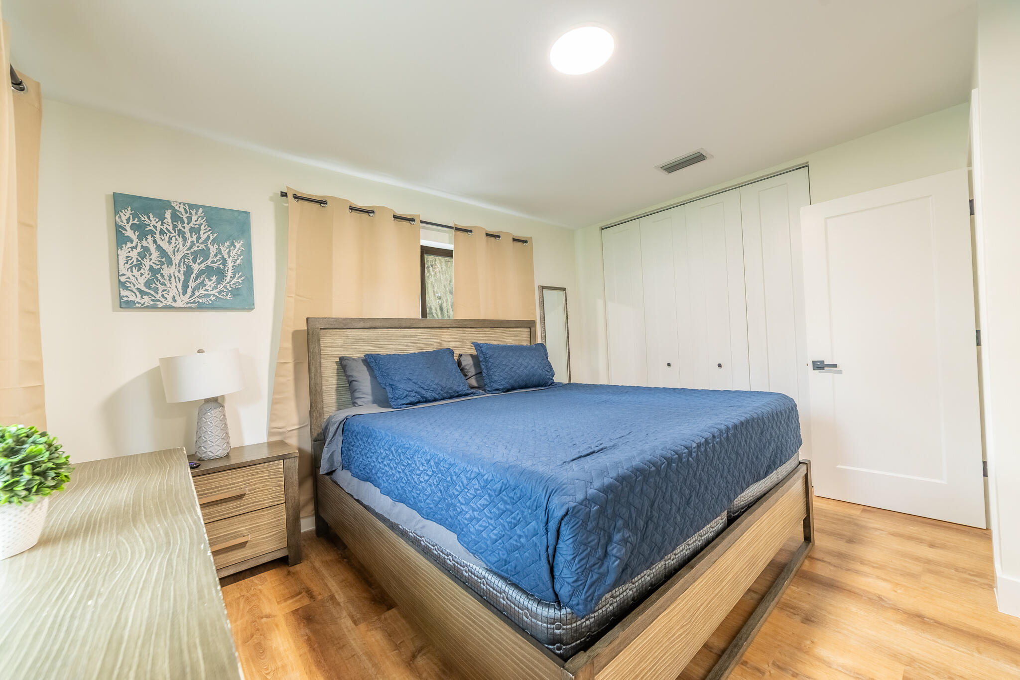 809 Southeast 12th Street Okeechobee, FL 34974 - Photo 22 of 62 a bedroom with a bed and window