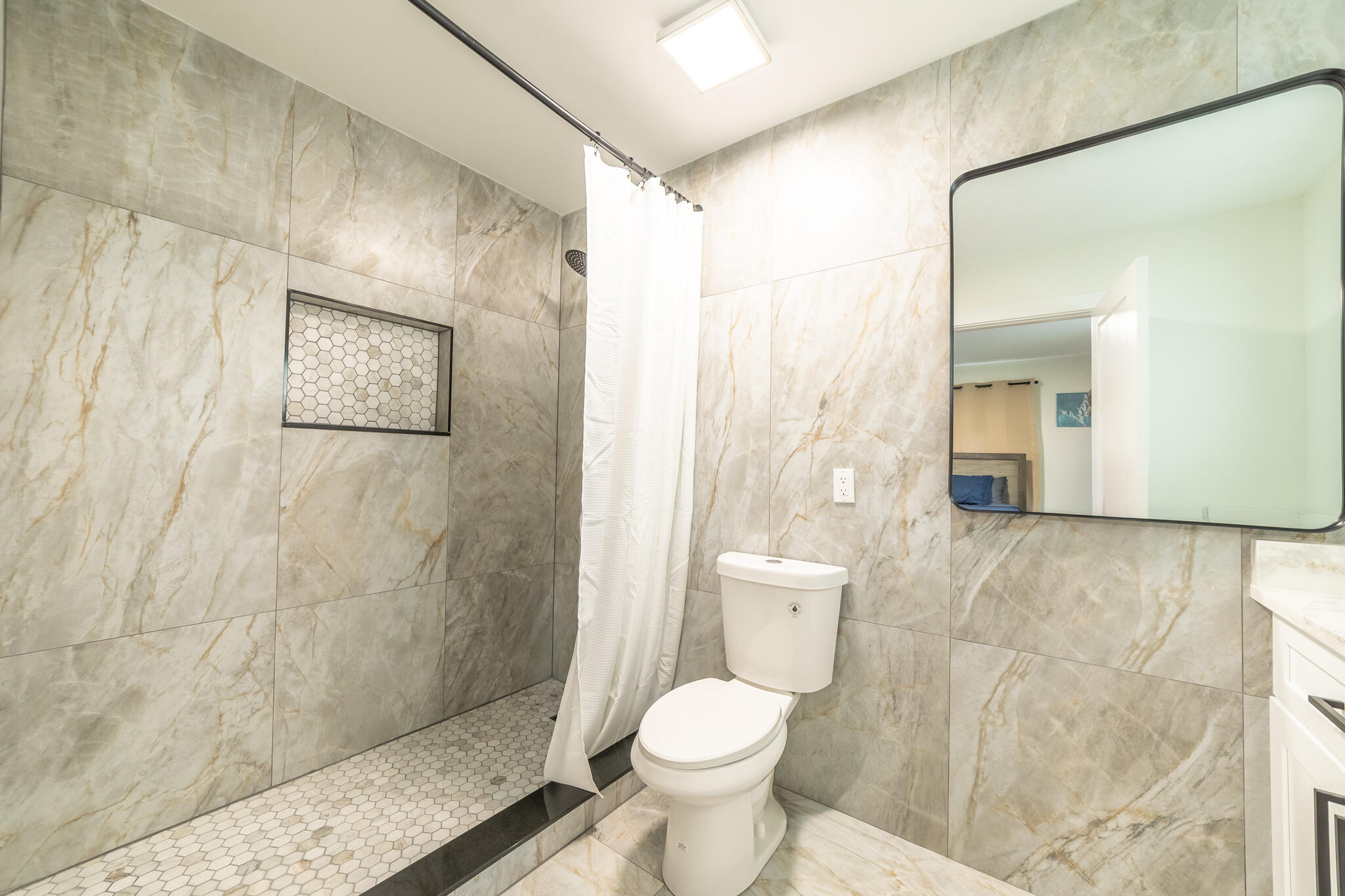 809 Southeast 12th Street Okeechobee, FL 34974 - Photo 24 of 62 a bathroom with a toilet and a shower