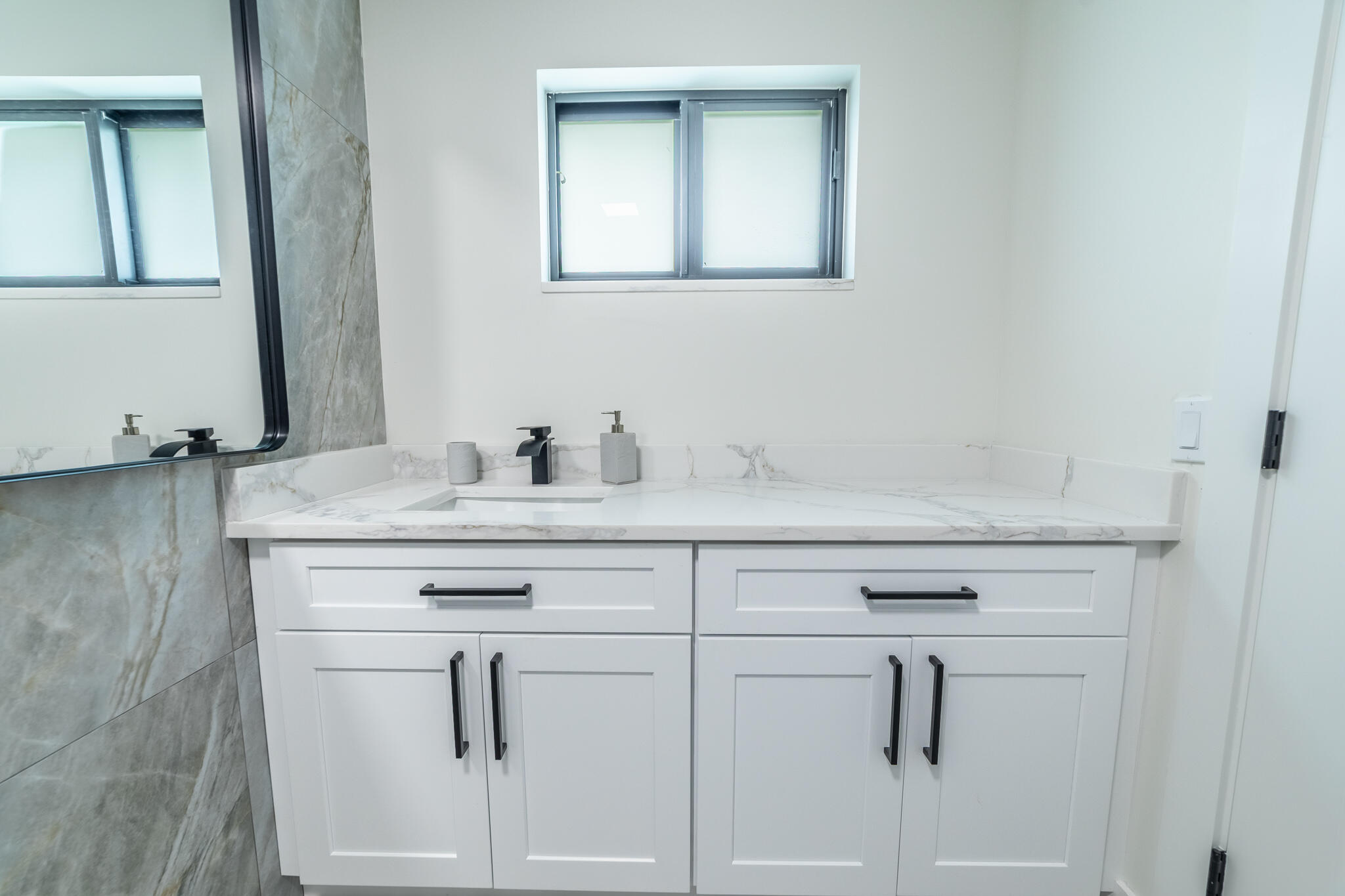809 Southeast 12th Street Okeechobee, FL 34974 - Photo 25 of 62 a bathroom with a sink vanity and mirror