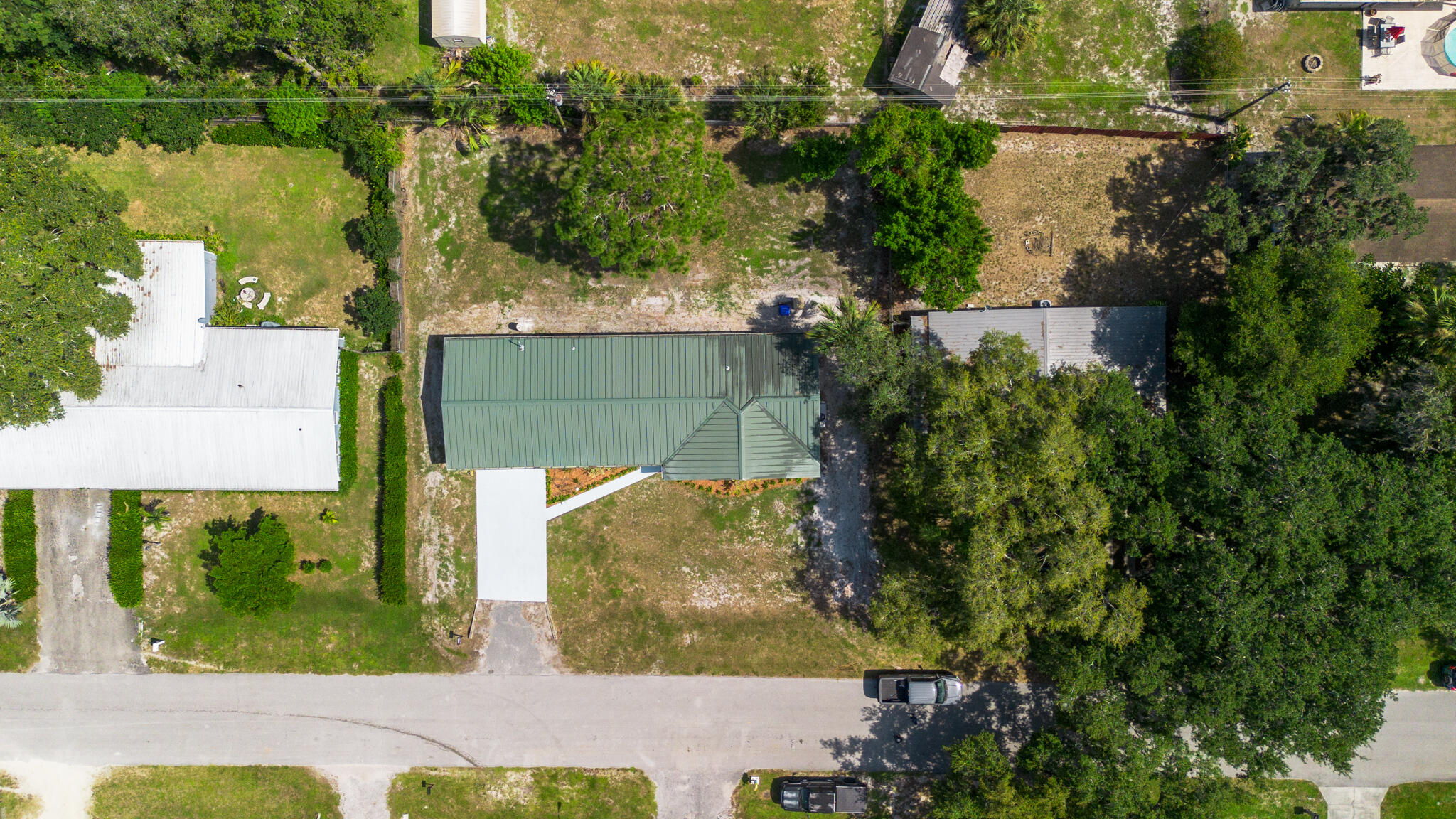 809 Southeast 12th Street Okeechobee, FL 34974 - Photo 48 of 62 an aerial view of a residential houses with outdoor space