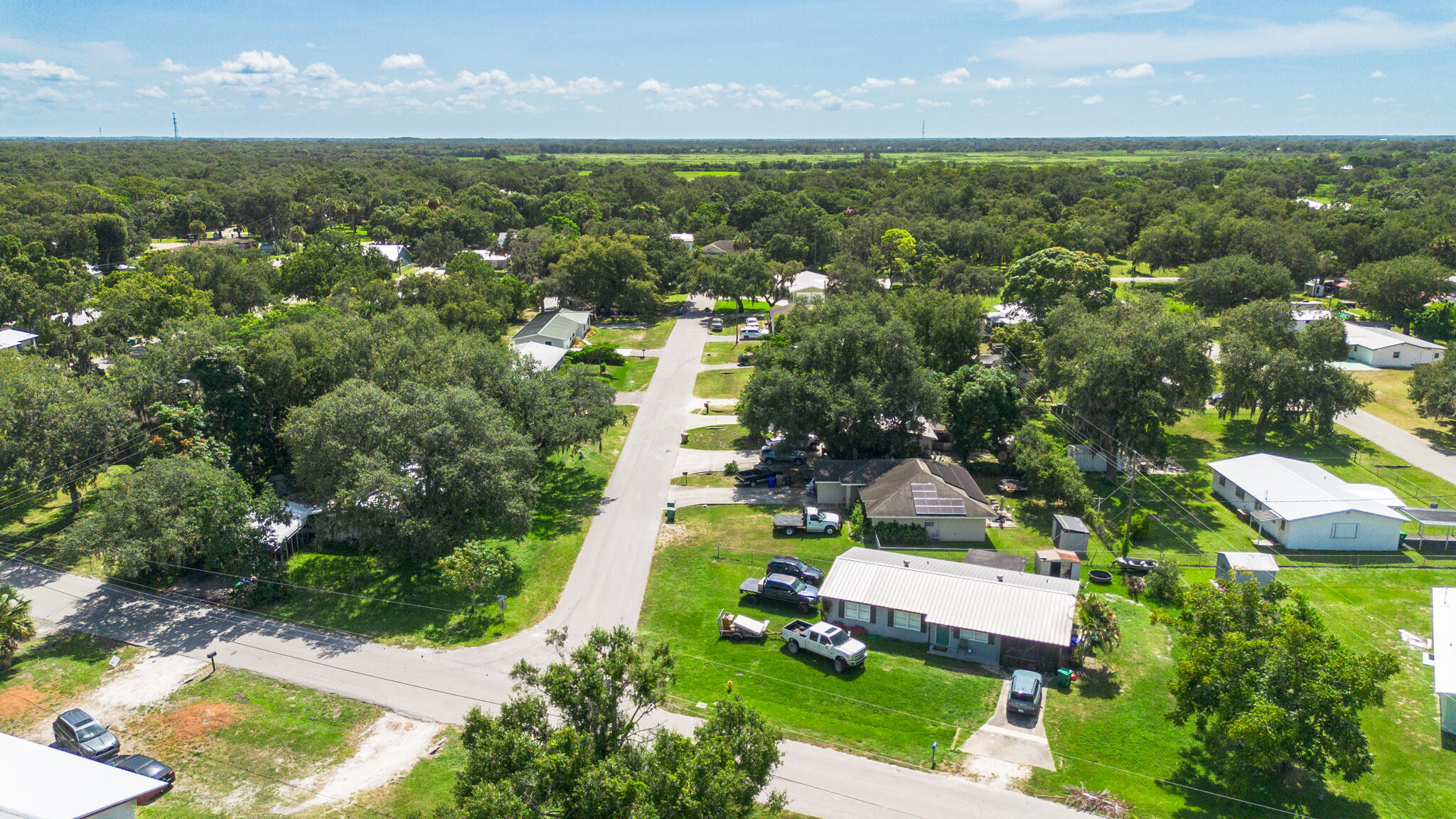 809 Southeast 12th Street Okeechobee, FL 34974 - Photo 53 of 62 an aerial view of residential houses with outdoor space and swimming pool