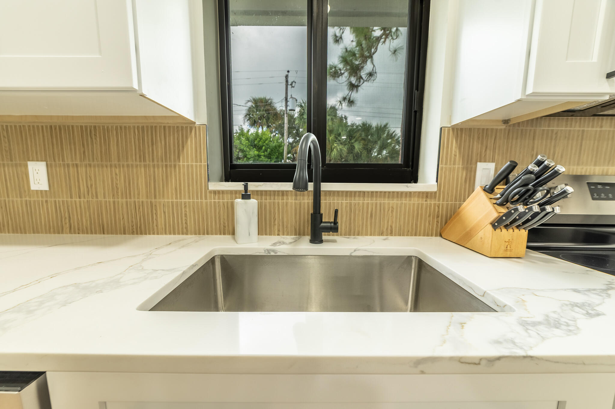 809 Southeast 12th Street Okeechobee, FL 34974 - Photo 10 of 62 a view of a kitchen counter top a sink and a window