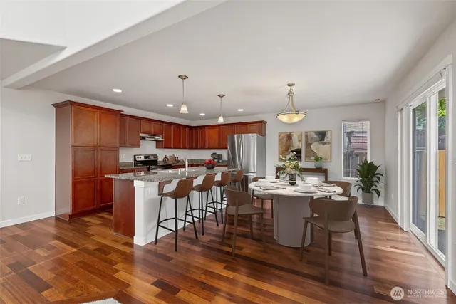 a view of a dining room with furniture window and wooden floor