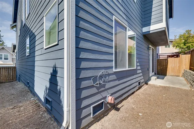 a view of a house with a door and wooden walls