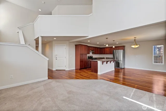 a view of kitchen with furniture and wooden floor