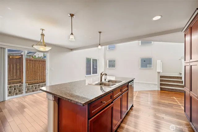 a kitchen with a stove and a sink