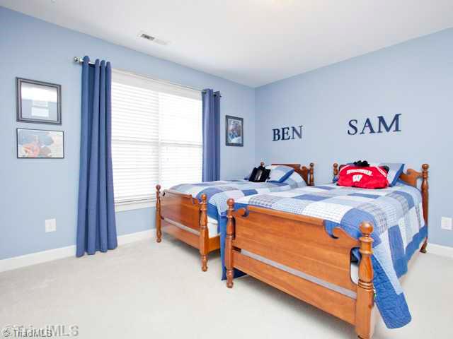 7839 Wilson Farm Road Summerfield, NC 27358 - Photo 11 of 16 3rd Bedroom. Third bedroom with double windows and walk in closet.