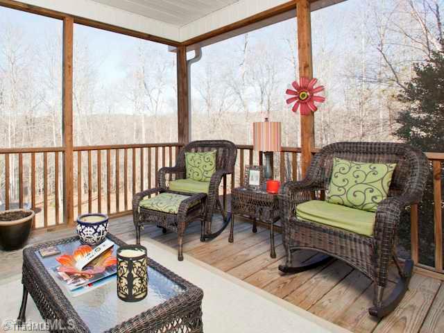 7839 Wilson Farm Road Summerfield, NC 27358 - Photo 13 of 16 Screened Porch. This is a wonderful space to enjoy all year round. The view is fantastic, must see!